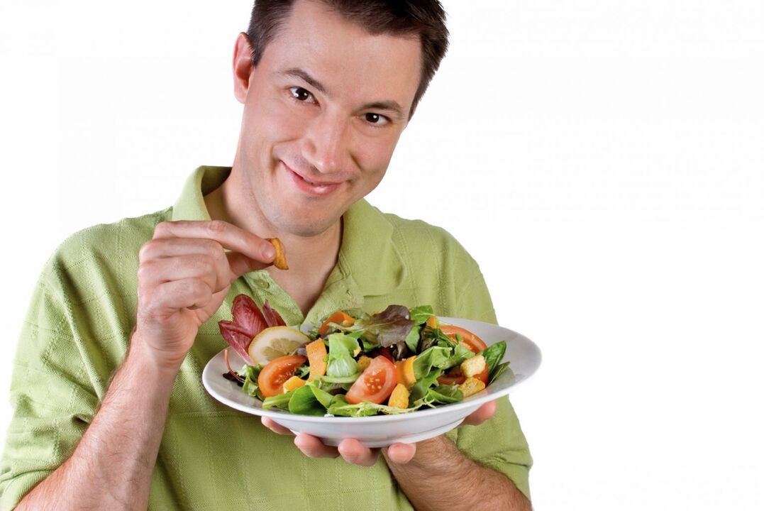 man eating vegetable salad for potency